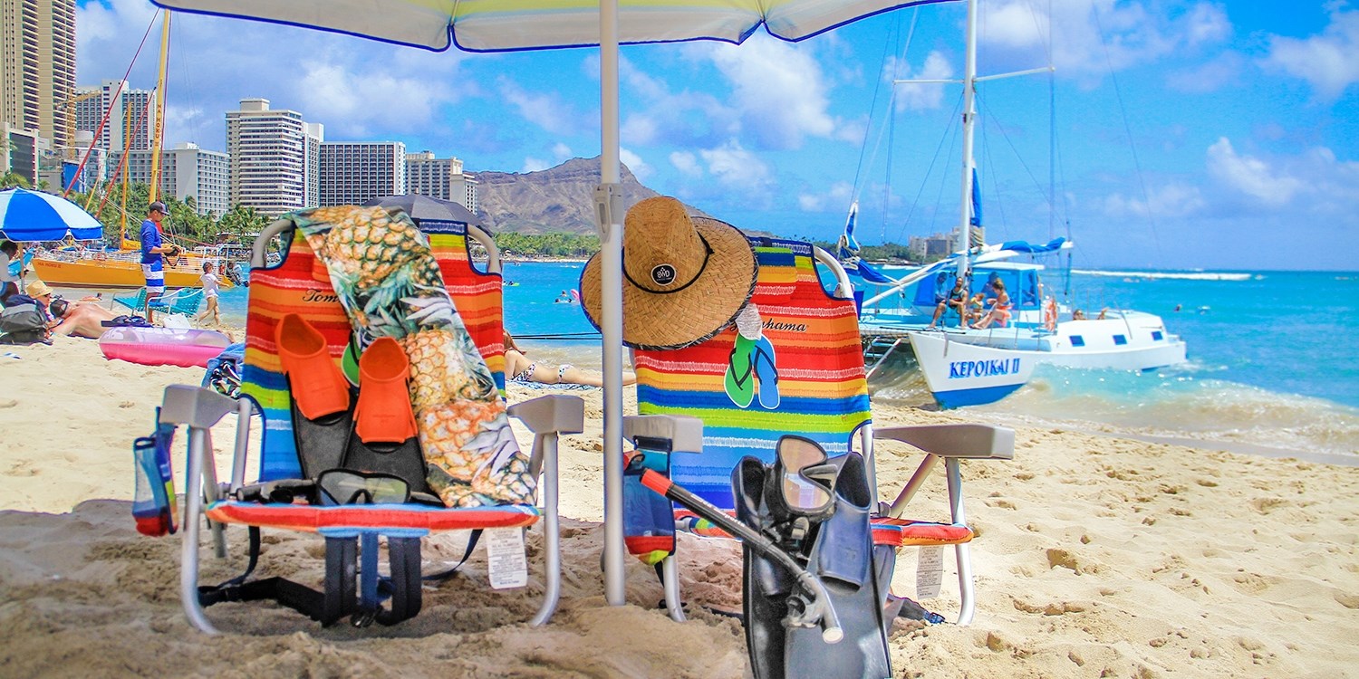 29 Waikiki Beach Day for 2 w/Snorkels, Umbrella & Chairs Travelzoo
