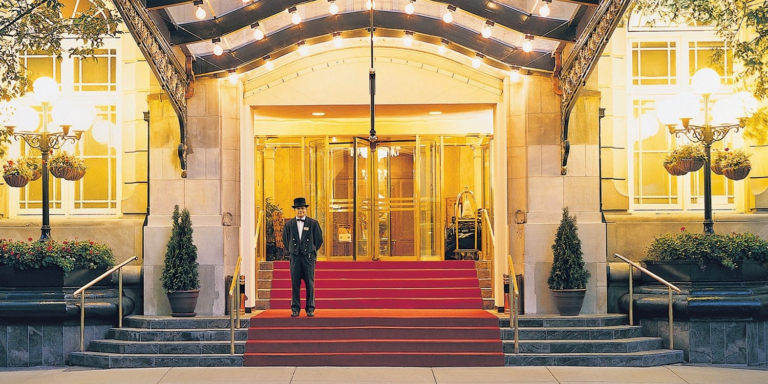 The hotel entrance is grand, leading into a regal and classic lobby