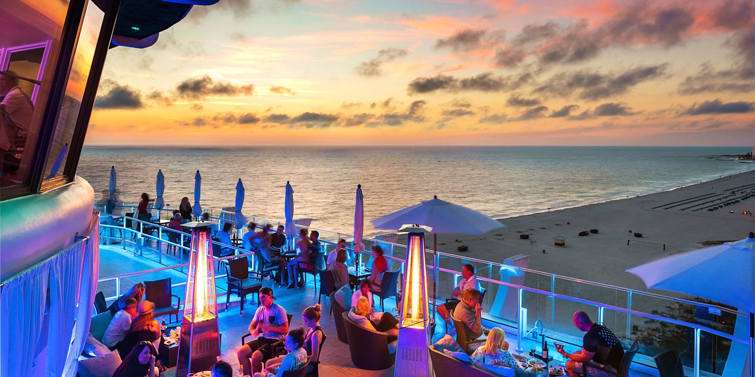 Sip cocktails while the sky turns orange, yellow and purple